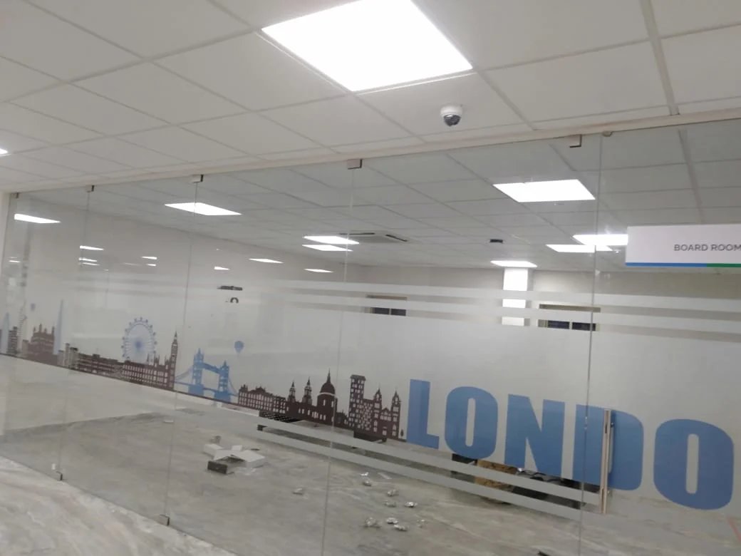 Custom printed frosted glass film for privacy and corporate branding